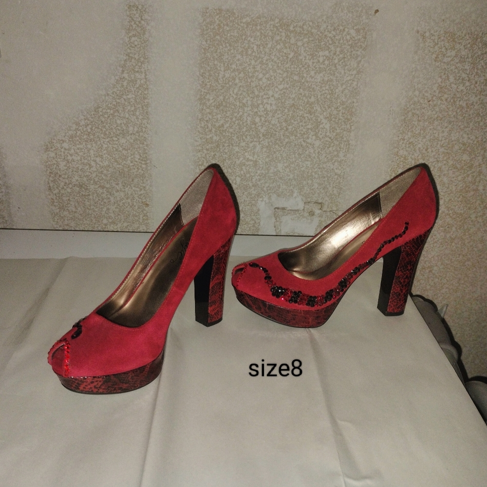 Platform suede and snakeskin decorated heels
